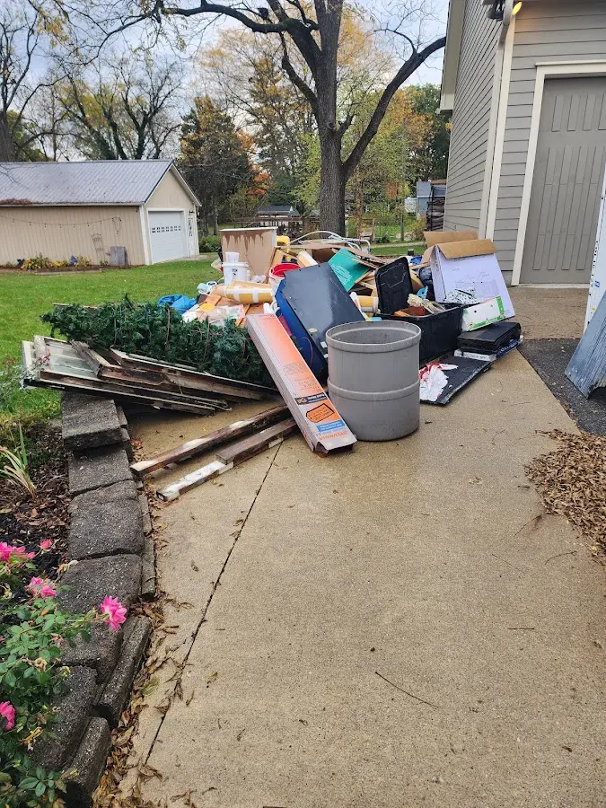 Dumpster being loaded with debris for Roofing Dumpster Rental in North River Shores